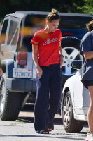 Olivia Wilde - wearing fuzzy slippers and a red shirt in LA, 5/19/2020